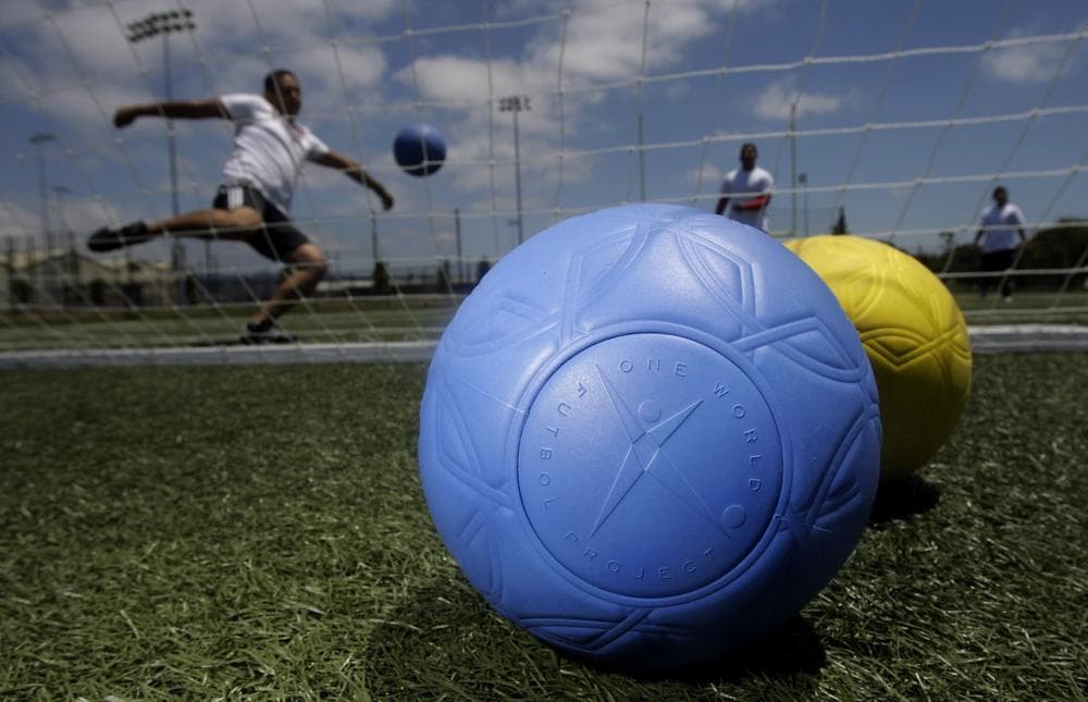 These colorful spheres don't need to be pumped, making it possible to play the beautiful game anywhere. (Jeff Chiu/AP)
