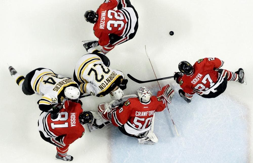 Chicago Blackhawks goalie Corey Crawford (50) blocks a shot against the Boston Bruins in the second period during Game 5 of the NHL hockey Stanley Cup Finals, Saturday, June 22, 2013, in Chicago. The Blackhawks won 3-1. (Nam Y. Huh/AP)