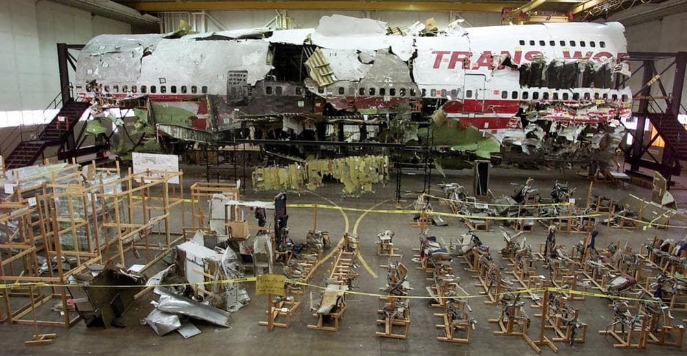 In this 2001 photo, the wreckage of TWA Flight 800 sit in a hangar in Calverton, N.Y. The seats of the plane are pictured in the foreground. The plane crashed off the coast of Long Island, N.Y., on July 17, 1996, killing 230 people. (Ed Betz/AP)