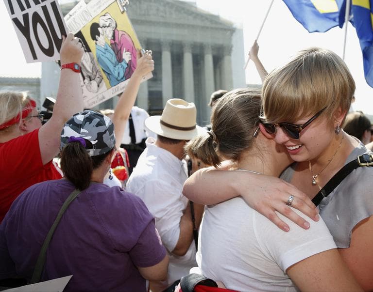 American University students Sharon Burk, left, and Molly Wagner, embrace after the Supreme Court  cleared the way for same-sex marriage in California.  (Charles Dharapak/ AP)