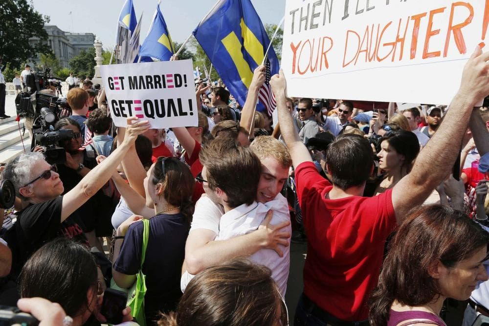 Supporters of gay marriage embrace outside the Supreme Court. (Charles Dharapak/ AP)