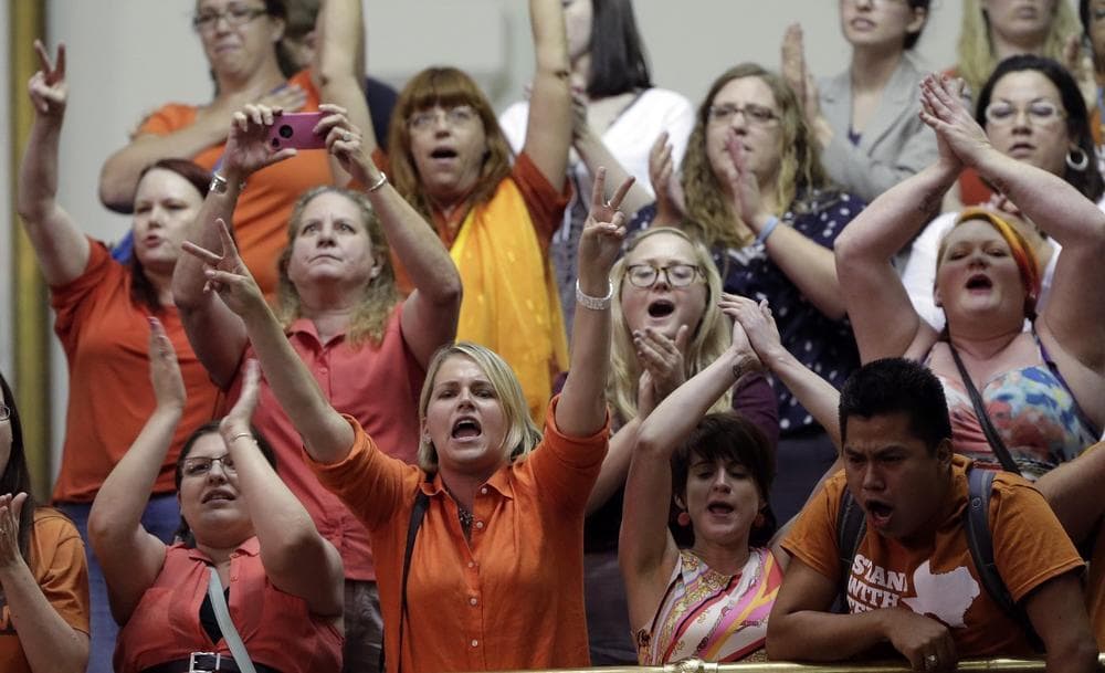 Members of the gallery cheer and chant as the Texas Senate tries to bring an abortion bill to a vote as time expires, Wednesday, June 26, 2013, in Austin, Texas. (Eric Gay/AP)