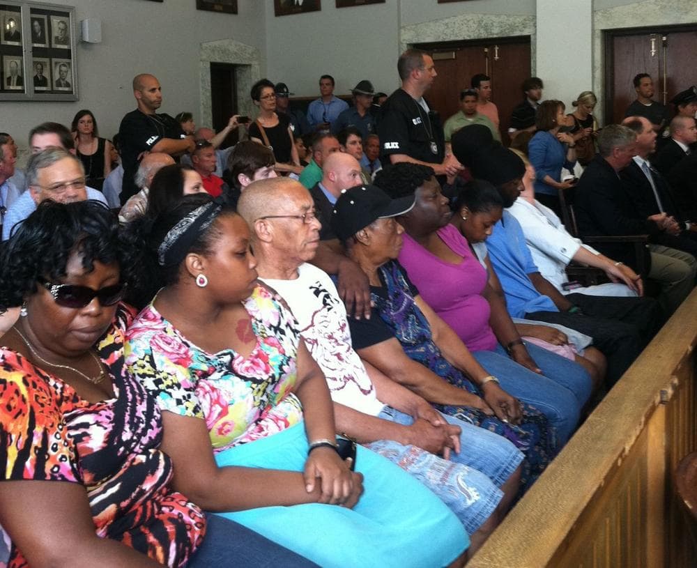 Victim Odin Lloyd's family members watch as Aaron Hernandez is arraigned on murder charges. (Delores Handy/WBUR)