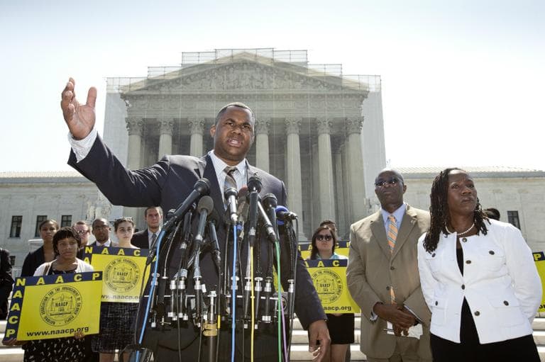 Ryan P. Haygood, director of the NAACP Legal Defense Fund, talks outside the Supreme Court in Washington, Tuesday, June 25, 2013, about the Shelby County v. Holder, a voting rights case in Alabama. Charles White, the national field director for the NAACP is second from right and Sherrilyn Ifill, president of the NAACP Legal Defense Fund is at right. The Supreme Court says a key provision of the landmark Voting Rights Act cannot be enforced until Congress comes up with a new way of determining which states and localities require close federal monitoring of elections. (J. Scott Applewhite/AP)