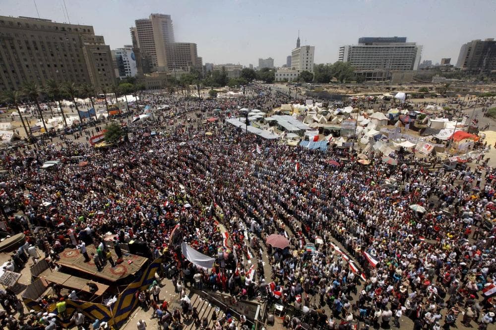 Opponents of Egypt's Islamist President Mohammed Morsi gather for noon prayers in Tahrir Square, the focal point of Egyptian uprising, in Cairo Sunday. (AP)