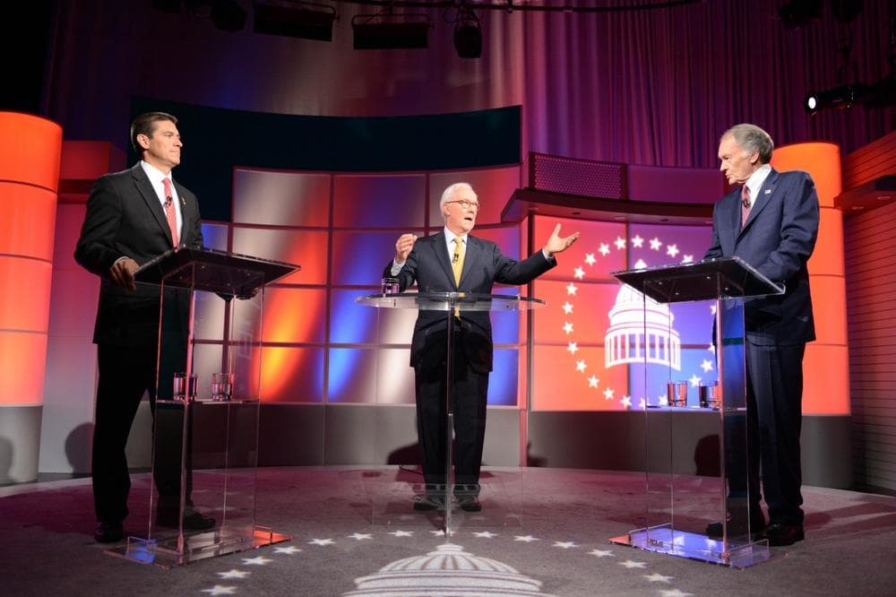 U.S. Senate candidates, Republican Gabriel Gomez, left, and Democratic U.S. Rep. Edward Markey, right before a debate moderated by R.D. Sahl, center, Tuesday, June 18, 2013, at WGBH studios in Boston. (AP Photo/ Meredith Nierman)