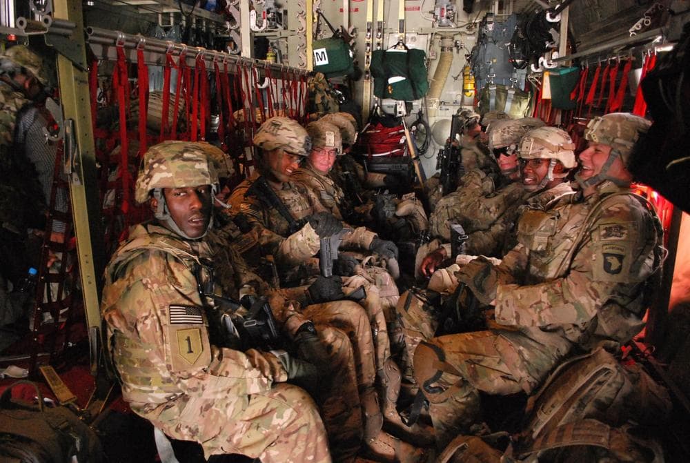 In this Tuesday, May 21, 2013 photo, U.S. Army soldiers from the 3rd Brigade Combat Team, 101st Airborne Division sit on a plane at Forward Operating Base Salerno in Afghanistan to return home to Fort Campbell, Ky. Heading toward the troop draw down in 2014, American combat brigades are being replaced by teams of advisers to assist the Afghan security forces. (Kristin M. Hall/AP)