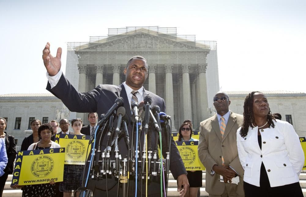 Ryan P. Haygood, director of the NAACP Legal Defense Fund, talks outside the Supreme Court in Washington, Tuesday, June 25, 2013, about the Shelby County v. Holder, a voting rights case in Alabama. Charles White, the national field director for the NAACP is second from right and Sherrilyn Ifill, president of the NAACP Legal Defense Fund is at right. The Supreme Court says a key provision of the landmark Voting Rights Act cannot be enforced until Congress comes up with a new way of determining which states and localities require close federal monitoring of elections. (J. Scott Applewhite/AP)