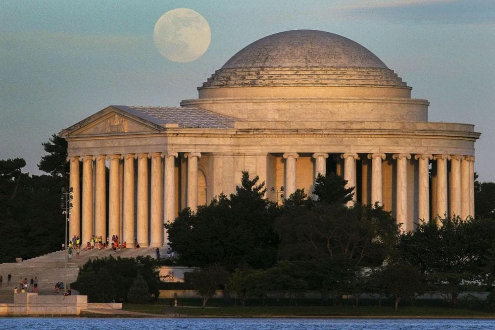 The moon rises behind the Jefferson Memorial in Washington, D.C. (J. David Ake/ AP)