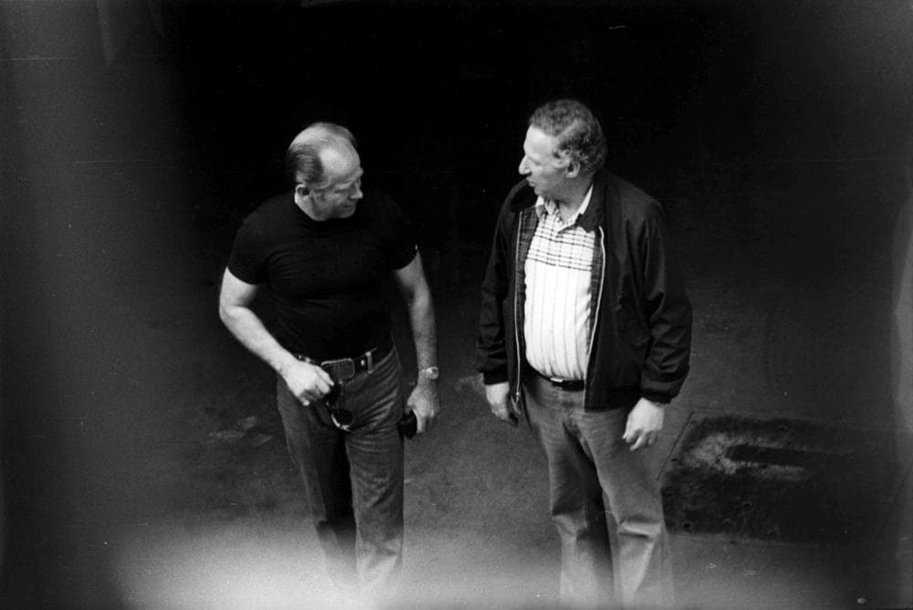 This 1980 black and white surveillance photo released by the U.S. Attorney's Office and presented as evidence during the first day of a trial for James &quot;Whitey&quot; Bulger in U.S. District Court in Boston, Wednesday, June 12, 2013, shows Bulger, left, with George Kaufman at a Lancaster Street garage in Boston's North End. Bulger is on trial for a long list of crimes, including extortion and playing a role in 19 killings. (AP)