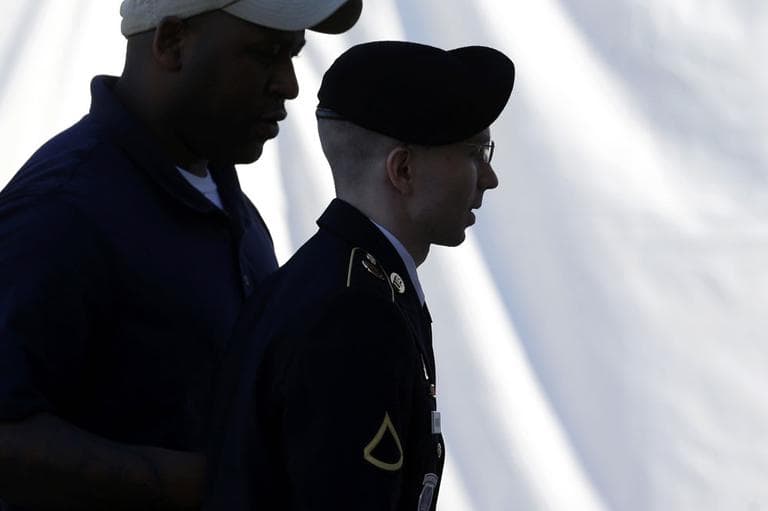Army Pfc. Bradley Manning, center, is escorted into a courthouse in Fort Meade, Md., Tuesday, June 4, 2013, before the second day of his court martial. Manning is charged with indirectly aiding the enemy by sending troves of classified material to WikiLeaks. He faces up to life in prison. (AP)