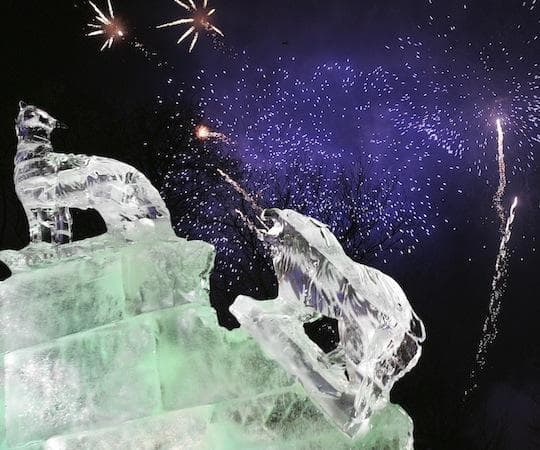 Fireworks explode over an native-american themed ice sculpture during  First Night Boston. (Michael Dwyer/AP)