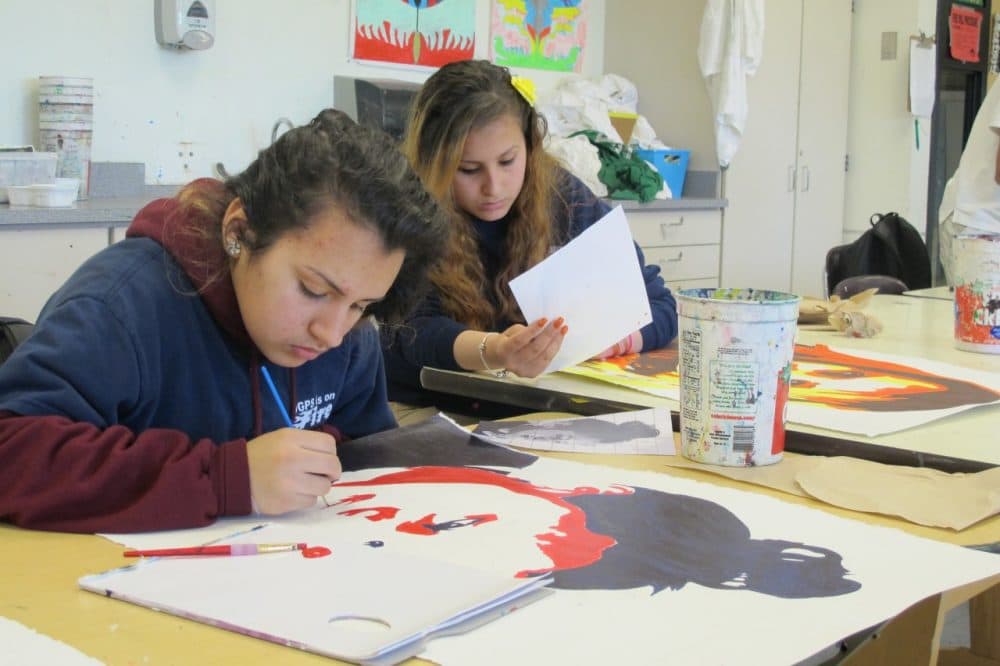 Students paint at the Orchard Gardens School. (Ava Aguado/WBUR)