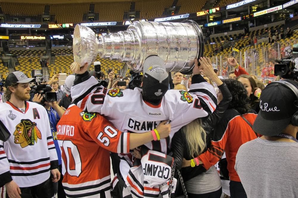 Chicago goalie Corey Crawford (holding cup) celebrates the Blackhawks' victory over the Boston Bruins Monday night at TD Garden in Boston. (Doug Tribou/Only A Game)
