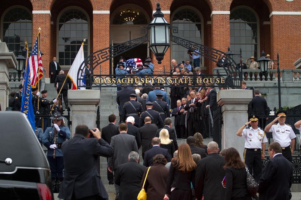 The late Paul Cellucci&#039;s casket is carried up the State House steps for a memorial service Thursday. (Jesse Costa/WBUR)