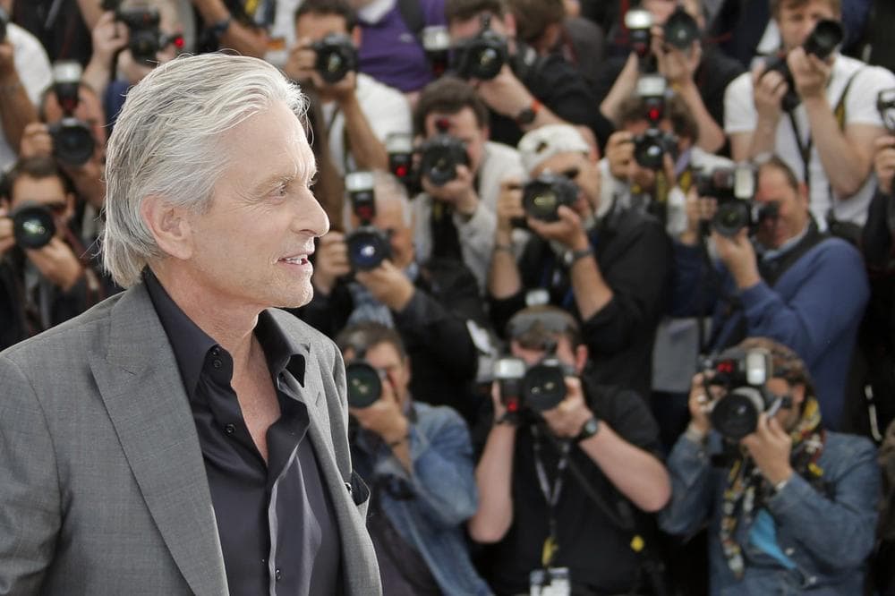 Actor Michael Douglas poses for photographers during a photo call for the film Behind the Candelabra at the 66th international film festival, in Cannes, southern France, Tuesday, May 21, 2013. (AP Photo/Francois Mori)