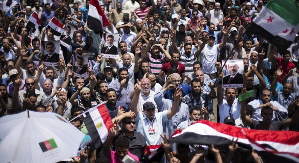 Supporters of Egypt's Islamist President Mohammed Morsi rally near Cairo University in Giza, Egypt, Tuesday, July 2, 2013. (Manu Brabo/AP)