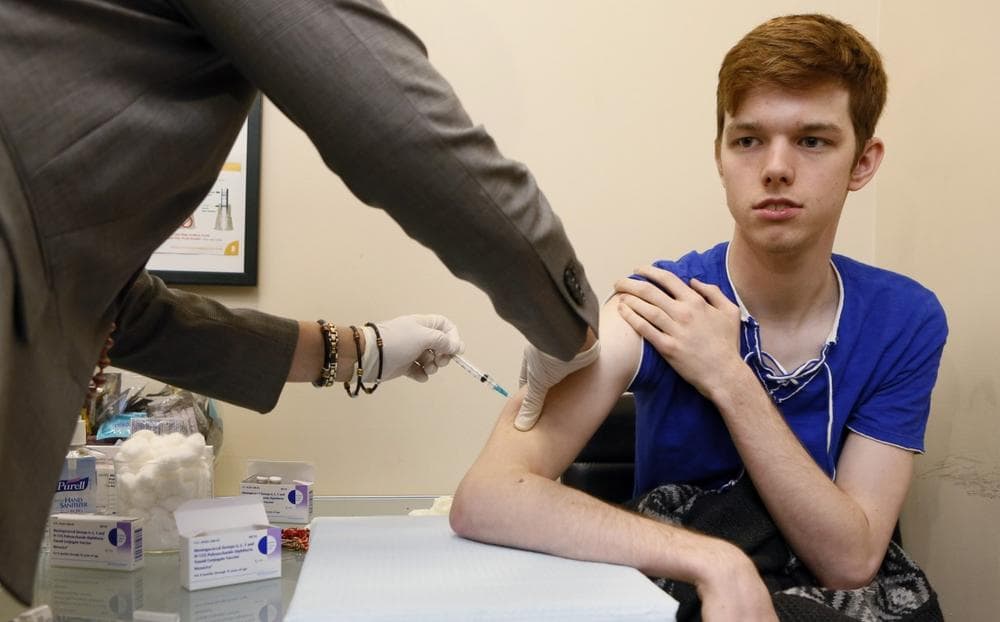 Allen Smith, 21, from West Hollywood, Calif., gets a free vaccine against bacterial meningitis at the AIDS Healthcare Foundation in West Hollywood, Calif., Monday, April 15, 2013. (Damian Dovarganes/AP)