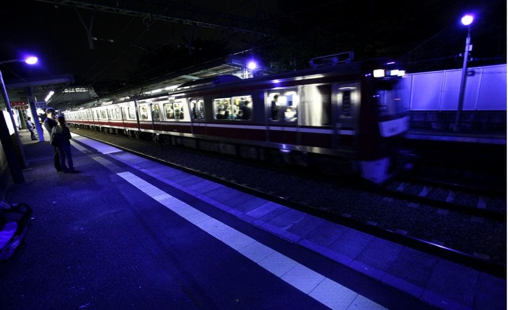 Alarmed by a rise in people jumping to their deaths in front of trains, Japanese railway operators are installing special blue lights above station platforms they hope will have a soothing effect and reduce suicides, Oct. 14, 2009. (Itsuo Inouye/AP)