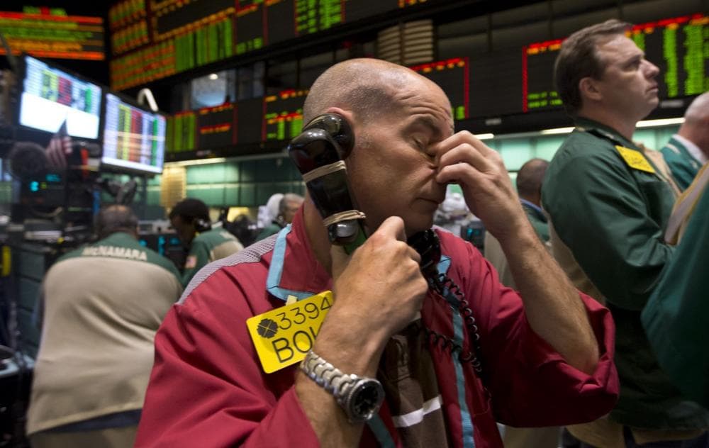 A trader works in the oil options pit at the New York Mercantile Exchange, Wednesday, July 3, 2013. (Richard Drew/AP)