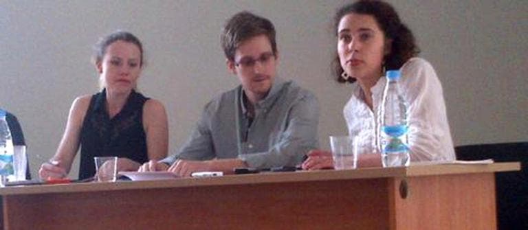 Edward Snowden attended a news conference at Moscow's Sheremetyevo Airport with Sarah Harrison of WikiLeaks, left, pm Friday. Reports say Snowden wants to seek temporary asylum in Russia (Tanya Lokshina/Human Rights Watch, )