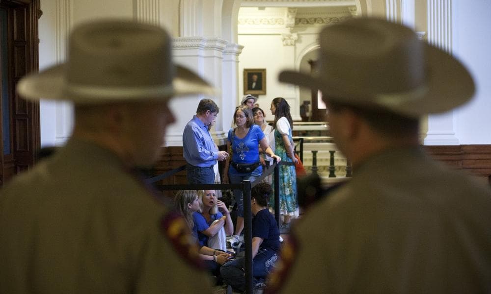 Dozens wait to enter the Senate gallery moments after the Texas State Capitol opened its doors at 7 a.m., in Austin, Texas, Friday, July 12, 2013. (Tamir Kalifa/AP)