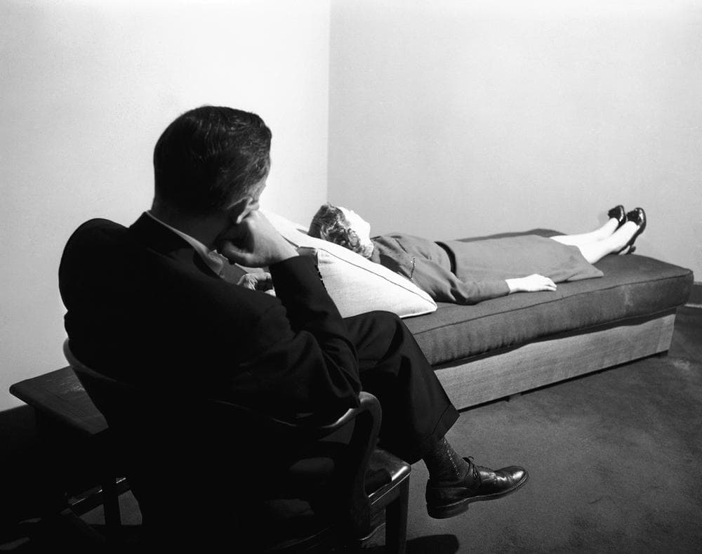 A psychoanalyst listens to a patient digging into her past at the New York Psychoanalytic Institute Treatment Center in New York, April 25, 1956. (Bob Wands/AP)