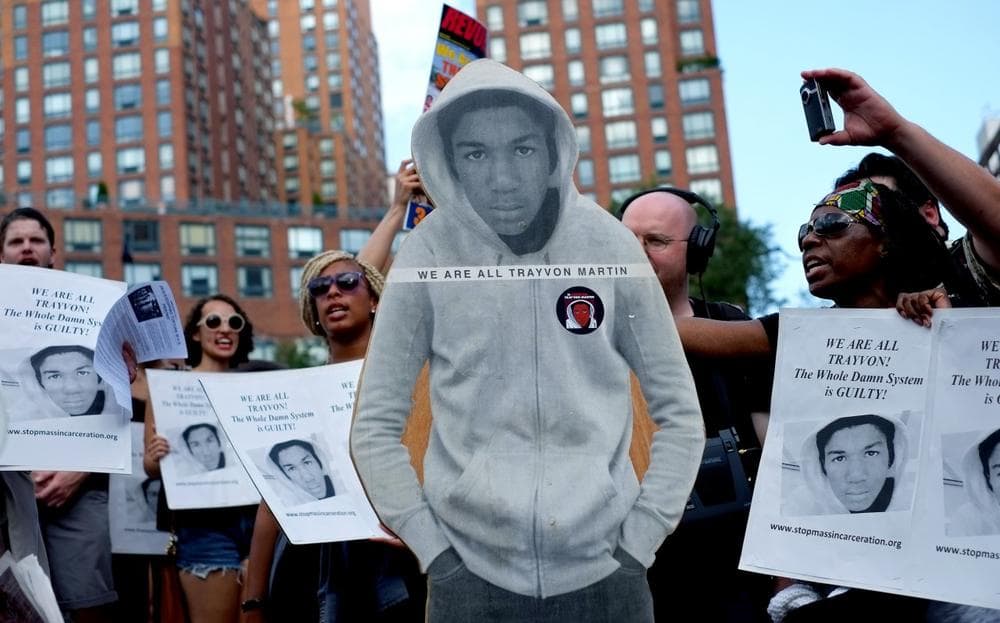 Activists on Union Square stand with a cut out photo of Trayvon Martin, Sunday, July 14, 2013, in New York, during a protest against the acquittal of volunteer neighborhood watch member George Zimmerman in the 2012 killing of 17-year-old Trayvon Martin in Sanford, Fla. (Craig Ruttle/AP)