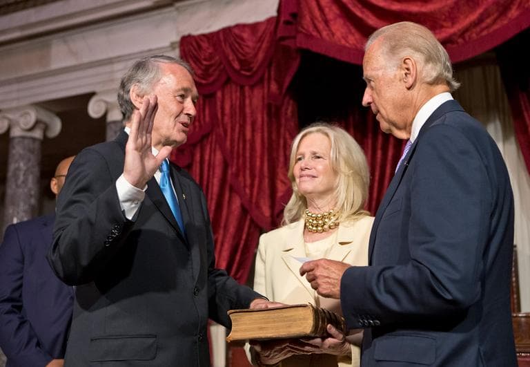 Sen. Edward Markey raises his hand to repeat the oath for Vice President Joe Biden in the Old Senate Chamber Tuesday, following his official ceremony earlier in the Senate Chamber. He is joined by his wife, Dr. Susan J. Blumenthal, center. (J. Scott Applewhite/AP)