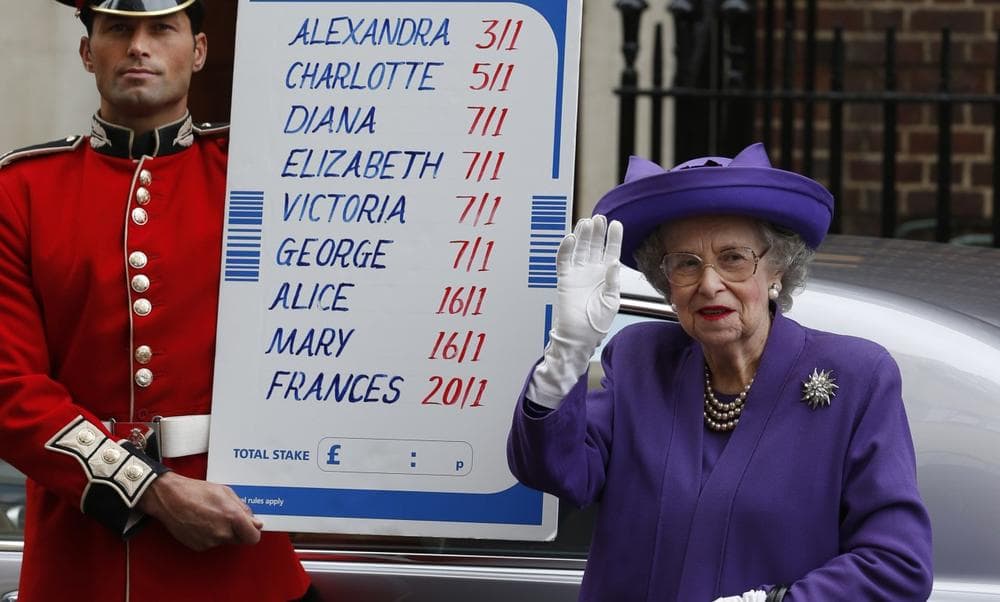 As part of a publicity stunt, people from a bookmakers office dressed as Britain's Queen Elizabeth II, right and a British Guardsman, left, stand with a placard with the odds for the name of the royal baby as they pose for the media outside St. Mary's Hospital exclusive Lindo Wing in London, Wednesday, July 3, 2013. (Lefteris Pitarakis/AP)