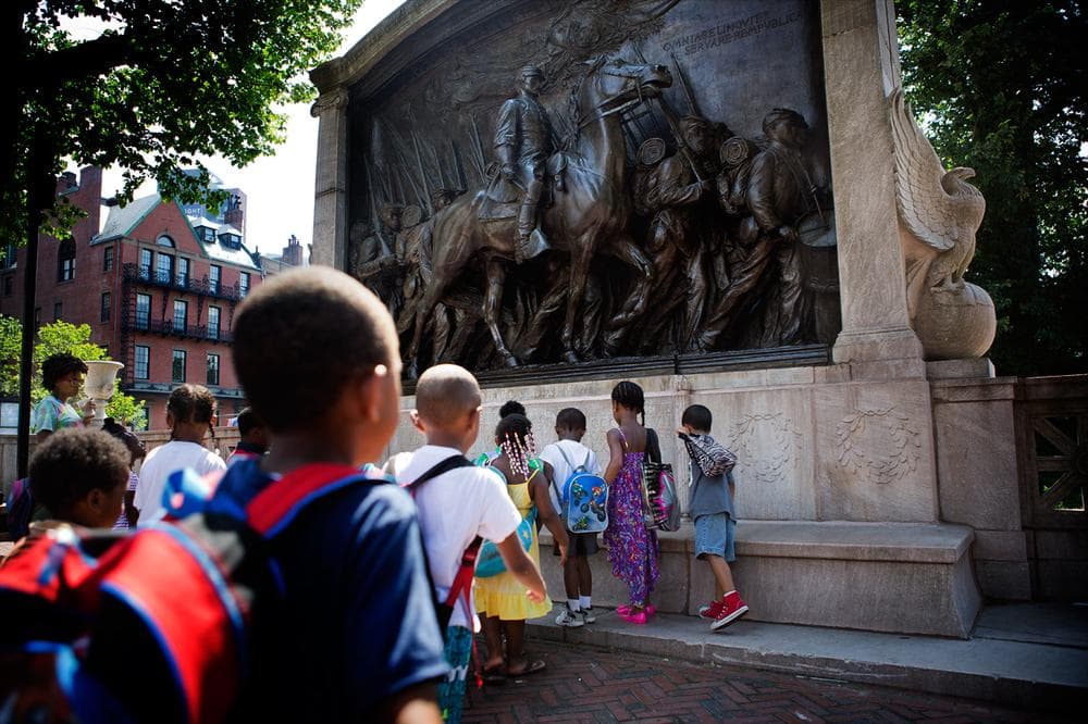 A group of elementary school students from Paige Academy in Roxbury approached the Shaw Memorial at the Boston Common. (Jesse Costa/WBUR)