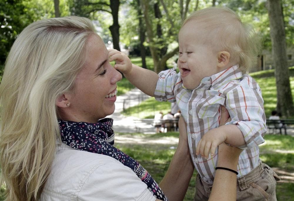 Erin Witkowski, of Port Jervis, N.Y., and her 16-month-old son Grady pose for photos in New York's Central Park, June 6, 2011. (Richard Drew/AP)