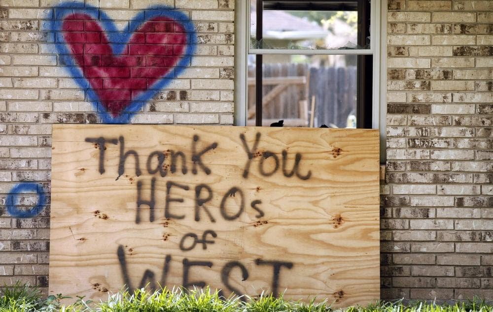 A home spray painted with a heart and an inspirational message, damaged by the fertilizer plant explosion along Reagan Street is shown Friday, May 31, 2013, in West, Texas. (Tony Gutierrez/AP)