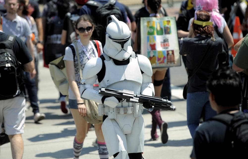 A Stormtrooper makes his way through the crowd during Day 2 of Comic-Con International on Thursday, July 18, 2013 in San Diego, Calif. (Chris Pizzello/Invision via AP)