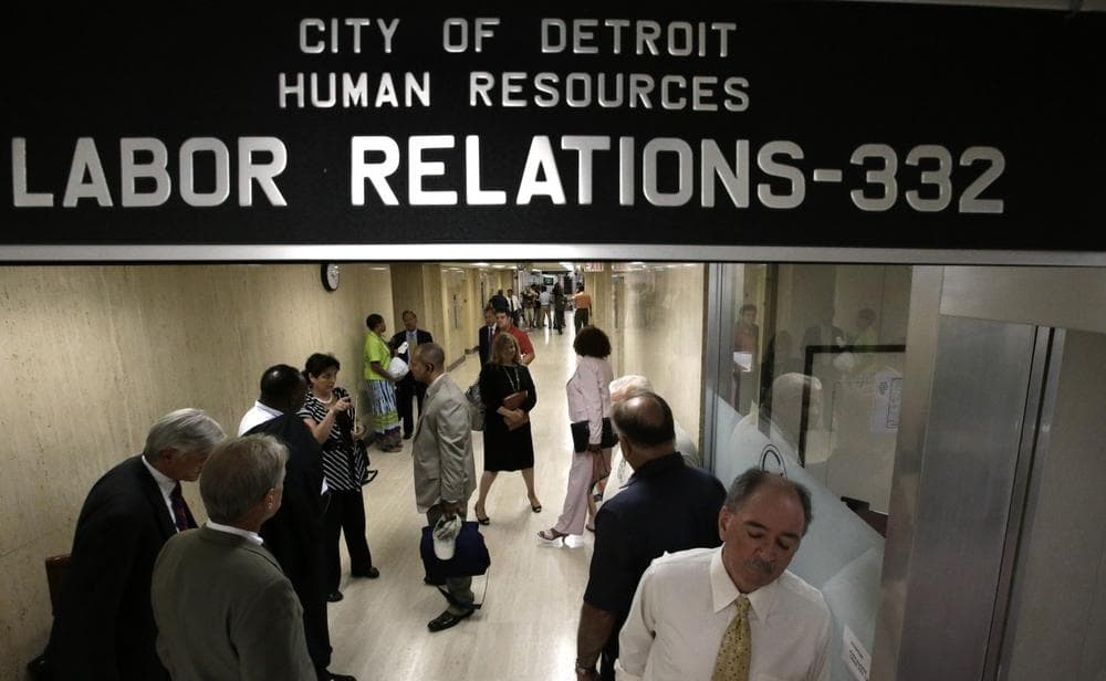 Representatives of Detroit&#039;s active and retired public workers wait for a meeting in Detroit, Wednesday, July 10, 2013. (Paul Sancya/AP)