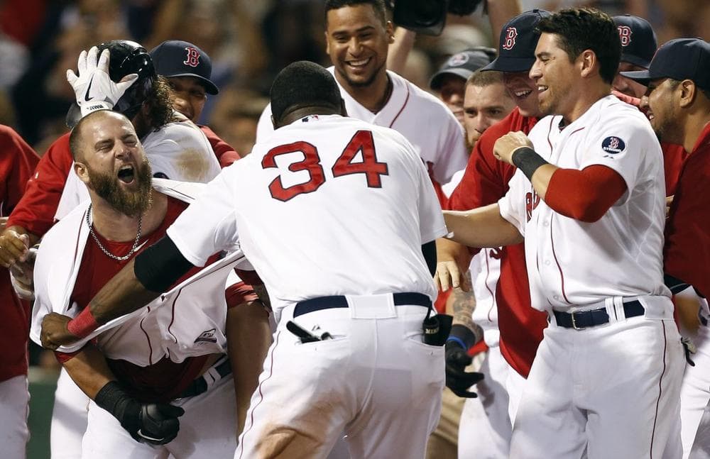 Boston Red Sox's Mike Napoli, left, celebrates his walk-off home run in the 11th inning of a baseball game against the New York Yankees in Boston. (AP/Michael Dwyer)