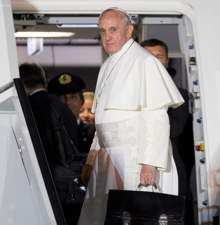 Pope Francis looks back before boarding a plane after his week-long visit to Brazil. (Andre Penner/AP)