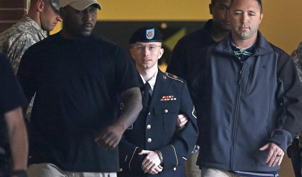 Army Pfc. Bradley Manning, center, is escorted to a security vehicle outside of a courthouse in Fort Meade, Md., Monday, July 29, 2013, after the third day of deliberations in his court martial. (Patrick Semansky/AP)