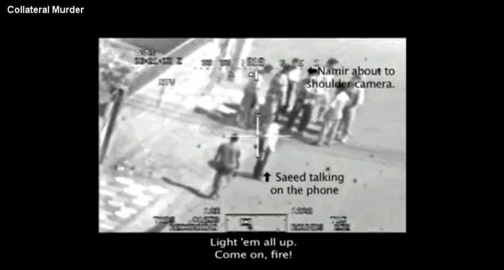 This frame grab image taken from a video shot from a U.S. army Apache helicopter gun-sight, posted at Wikileaks.org and confirmed as authentic by a senior U.S. military official, shows a group of men in the streets of the New Baghdad district of eastern Baghdad just prior to being fired upon by the helicopter July 12, 2007. In a series of online chats Bradley Manning told of leaking classified diplomatic reports, along with this secret video, to the whistleblower website Wikileaks.org. Wikileaks.org via AP)