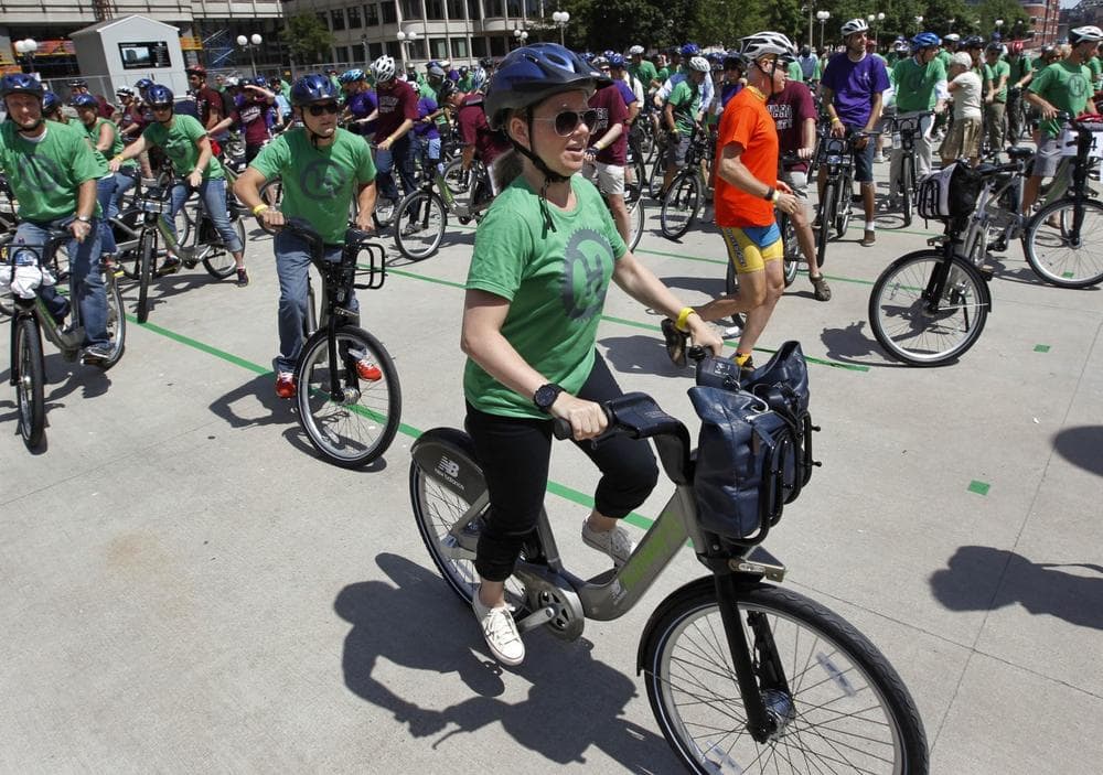 Boston's Hubway bike-sharing program is popular, but are people ready to give up their cars completely? (Steven Senne/AP)