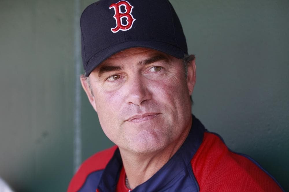 Boston Red Sox manager John Farrell talks to reporters in the dugout before an exhibition spring training baseball game against the Baltimore Orioles, Monday, March 25, 2013 in Sarasota, Fla. (AP Photo/Carlos Osorio)