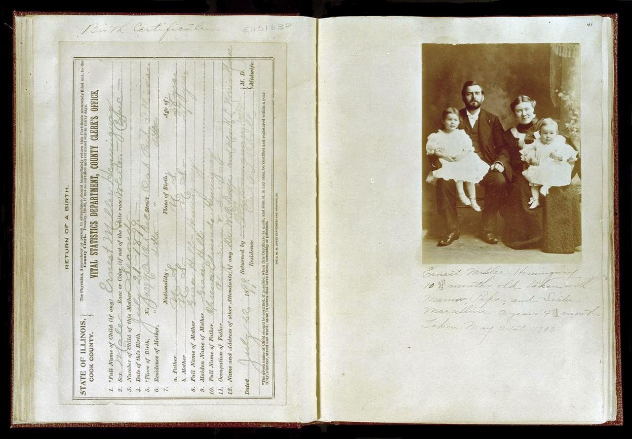 This photo provided  by the John F. Kennedy Presidential Library shows the birth certificate and family photograph of Ernest Hemingway from a scrapbook created by his mother, Grace Hall Hemingway. (AP Photo/John F. Kennedy Presidential Library)
