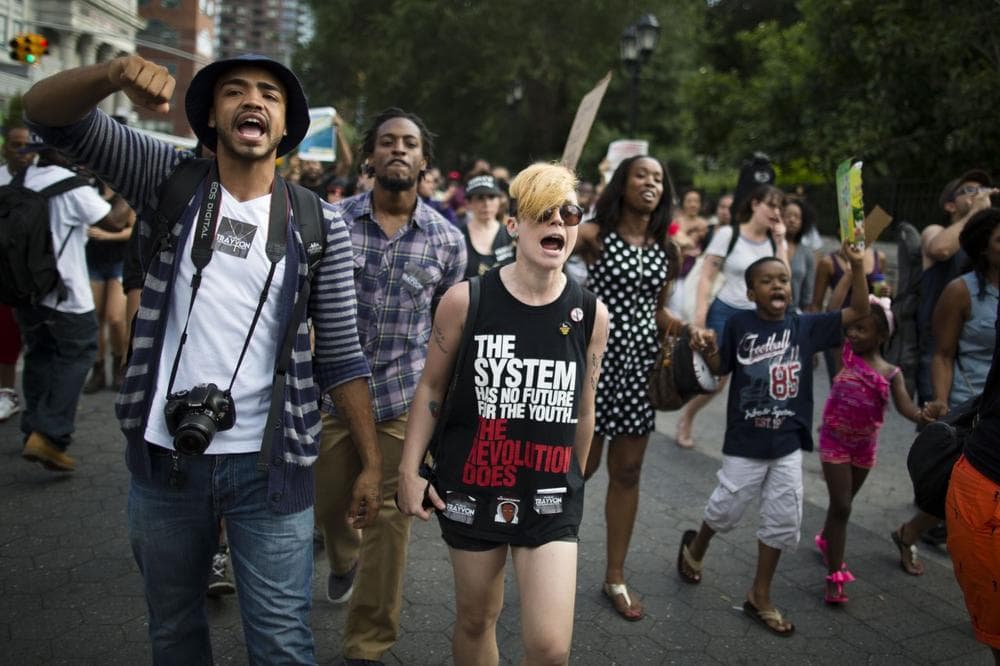 Demonstrators march in Union Square, Sunday, July 14, 2013, in New York,during a protest against the acquittal of neighborhood watch member George Zimmerman in the killing of 17-year-old Trayvon Martin in Florida. Demonstrators upset with the verdict protested mostly peacefully in Florida, Milwaukee, Washington, Atlanta and other cities overnight and into the early morning. (John Minchillo/AP)