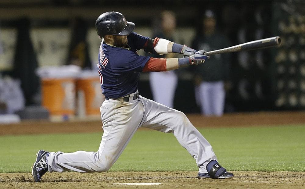 Dustin Pedroia swings for a two run single off Oakland Athletics' Ryan Cook in the eighth inning Friday in Oakland, Calif. (AP Photo/Ben Margot)