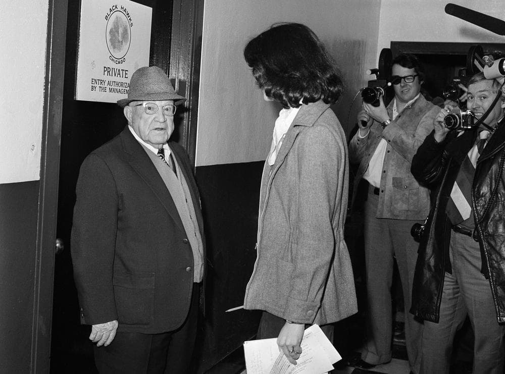 Robin Herman, sports writer for the New York Times, is confronted by Chicago Black Hawks doorman Gordon Robertson outside the Black Hawks dressing room at Chicago, Jan. 24, 1975. Robertson kept Miss Herman from interviewing Black Hawks players until Chicago Black Hawks coach Billy Reay felt the team was presentable. Black Hawks won against New York Islanders, 3-1. (AP Photo)