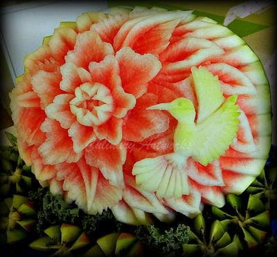 Arroco used the red and white fruit inside the watermelon to create this hummingbird and flower design. (Courtesy of Ruben Arroco)