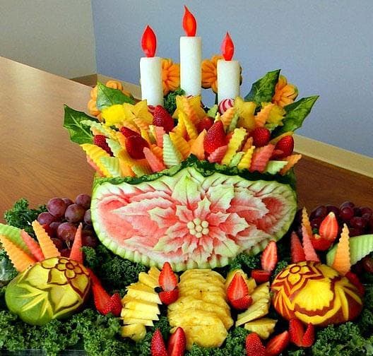 White radishes become candles in this Christmas fruit carving. (Courtesy of Ruben Arroco)