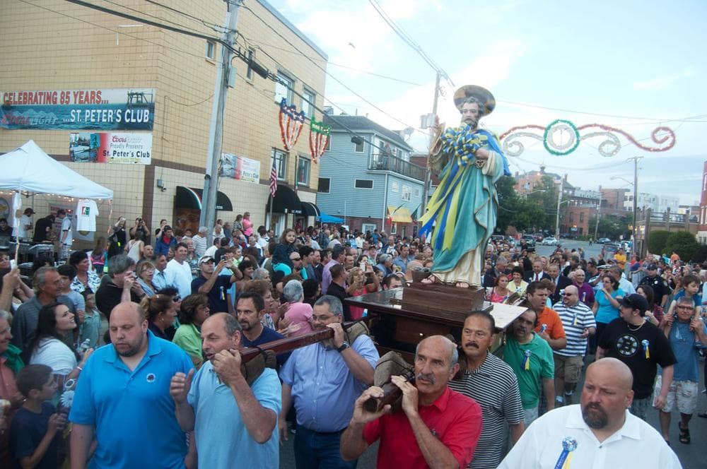 A crowd fills Rogers Street on Friday evening to watch the opening procession of the statue of St. Peter from the St. Peter’s Club to the temporary outdoor altar on the waterfront in St. Peter’s Square. (Greg Cook)
