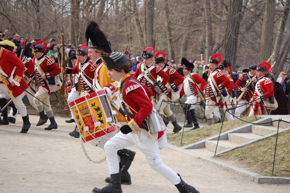 British soldiers flee from the battle at Concord Bridge during a Patriots Day reenactment. (Greg Cook)