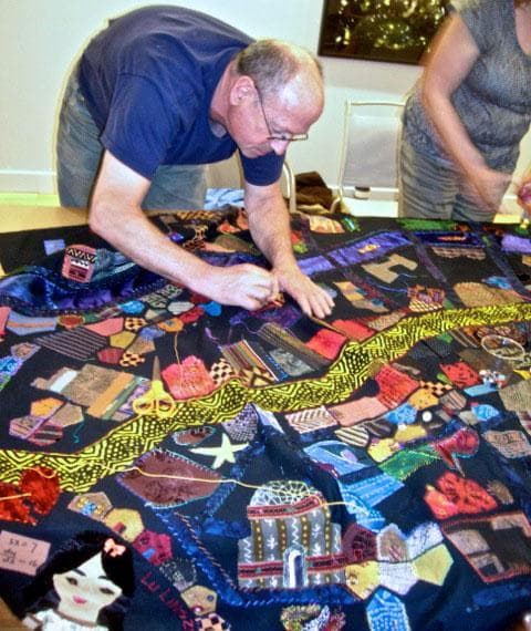 Stitching buildings onto the &quot;Mending Boston&quot; quilt. (Courtesy photo)